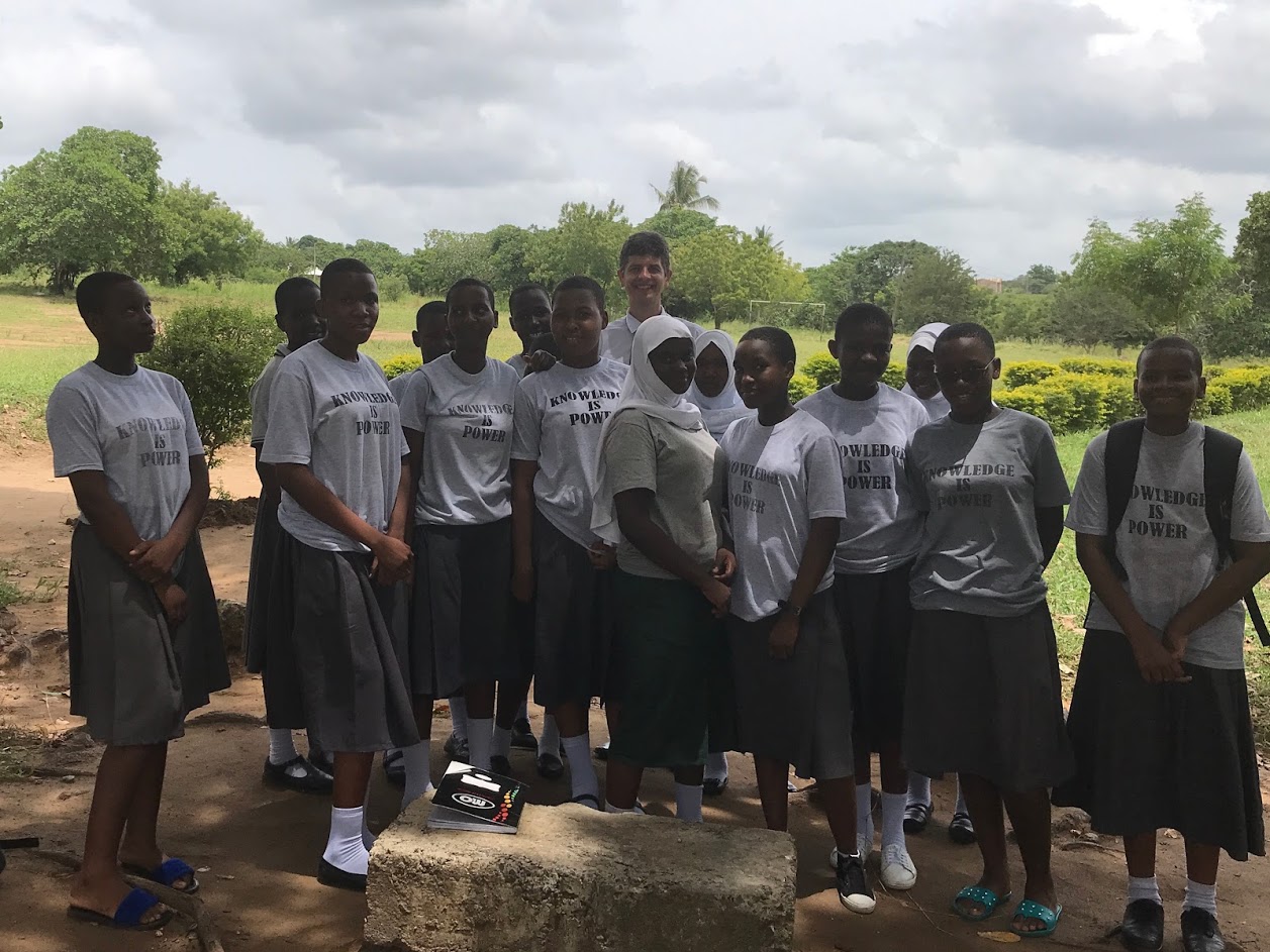 founder-and-students The founder of end world hunger standing with a group of African girls under the shade